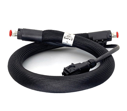 Custom-built heated hose with connectors, designed for industrial hot-melt adhesive systems.